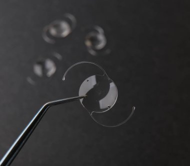 closeup photo of elastic intra ocular lens for cataract surgery