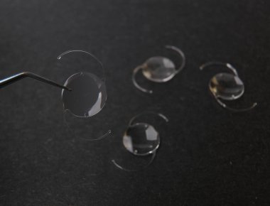 closeup photo of elastic intra ocular lens for cataract surgery