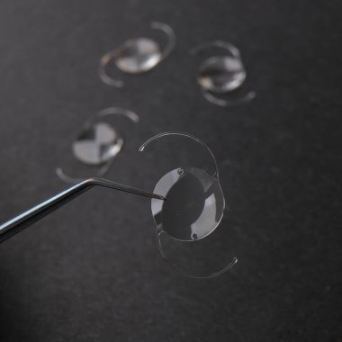 closeup photo of elastic intra ocular lens for cataract surgery