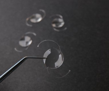 closeup photo of elastic intra ocular lens for cataract surgery