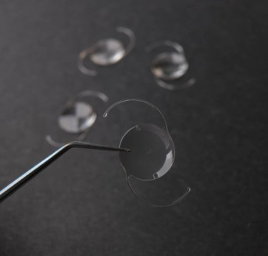 closeup photo of elastic intra ocular lens for cataract surgery