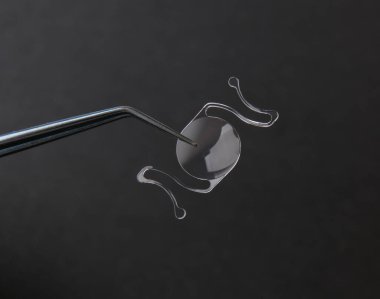 closeup photo of elastic intra ocular lens for cataract surgery