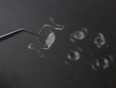 closeup photo of elastic intra ocular lens for cataract surgery