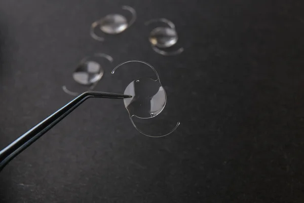 closeup photo of elastic intra ocular lens for cataract surgery