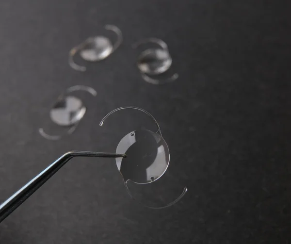 closeup photo of elastic intra ocular lens for cataract surgery