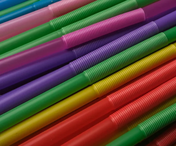 closeup photo of plastic colored juice straws