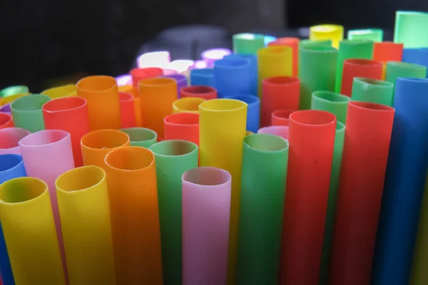 closeup photo of plastic colored juice straws