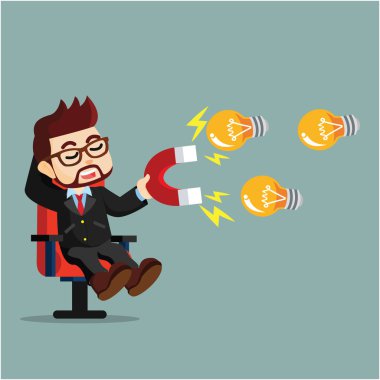 bir işadamı mıknatıslar ile lamba çekiyor