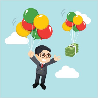 para yakalamak için bir balon ile uçan bir işadamı
