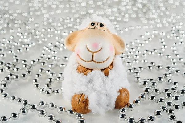 Arka plan Gümüş Boncuklar oyuncak koyun