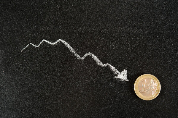 Coin Euro on the background of the graph reduction.