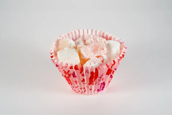 Turkish Delight in tins on a white background Stock Photo