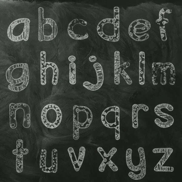 Lower case alphabet on black board — Stock Photo, Image