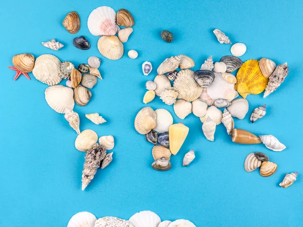 Map of the world made of shells on blue background — Stock Photo, Image