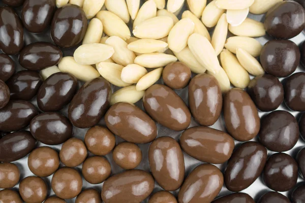 Variety of almonds in chocolate — Stock Photo, Image