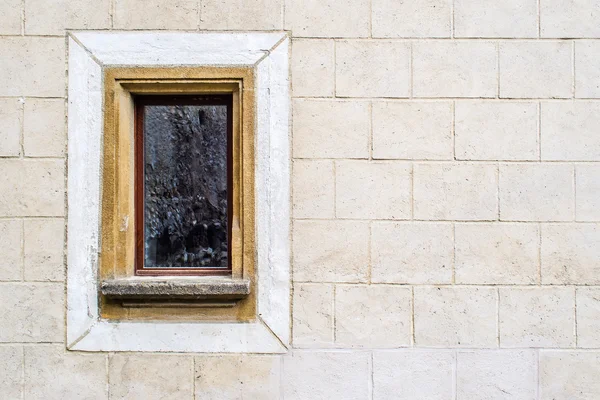 Uncared and crooked wall with old window — Stock Photo, Image