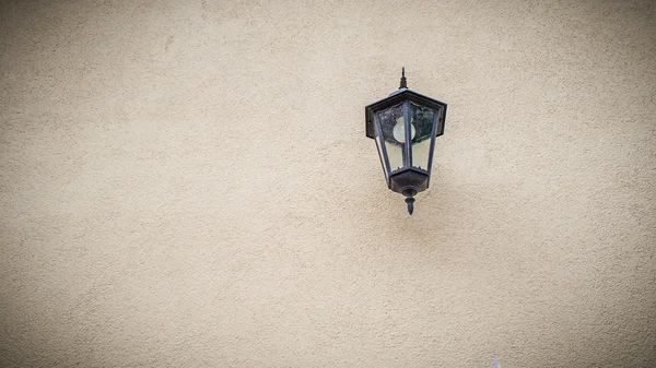 Old lantern hanging on an old house — Stock Photo, Image