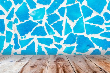 blue glass mosaic wall and brown wooden floor clipart