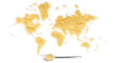 map of the world made of cane sugar with metallic spoon full of  clipart