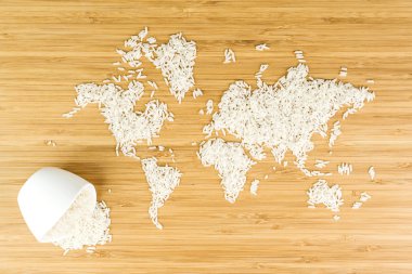 map of the world made of white rice with white ceramic bowl clipart