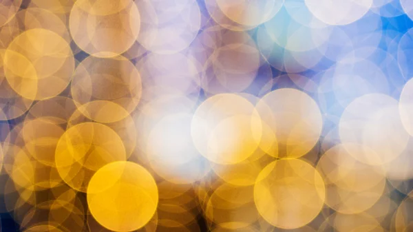 Bokeh von warmen orangen Lichtern auf defokussiertem Hintergrund — Stockfoto