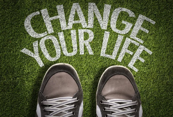 Sneakers on the grass with the text — Stock Photo, Image