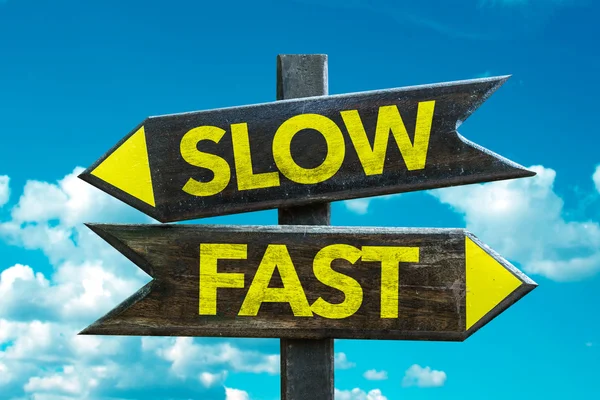 Slow - Fast signpost — Stock Photo, Image