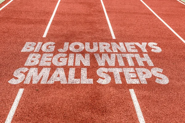 journeys Begin With Small Steps written on track