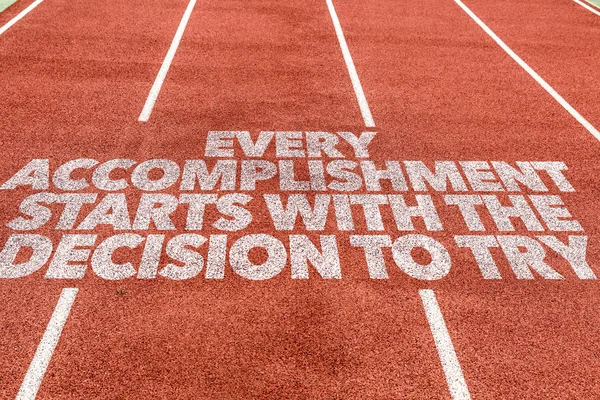 Accomplishment Starts With the Decision written on track