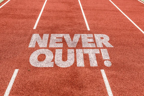Never Quit written on track — Stock Photo, Image