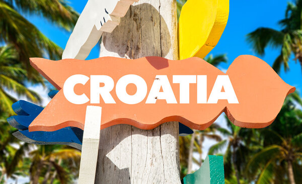 croatia signpost with palm trees