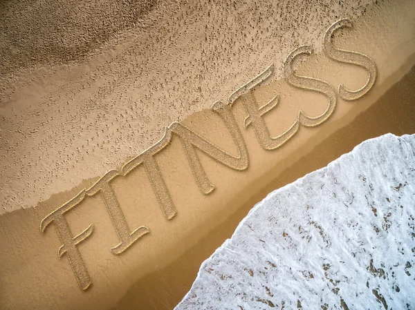 Fitness geschreven op het strand — Stockfoto