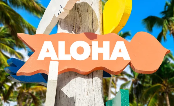 Aloha signpost with beach — Stok fotoğraf