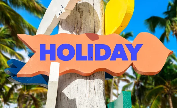 Holiday signpost with beach — Stock Photo, Image