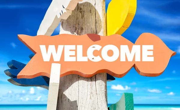 Welcome signpost with beach — Stock Photo, Image