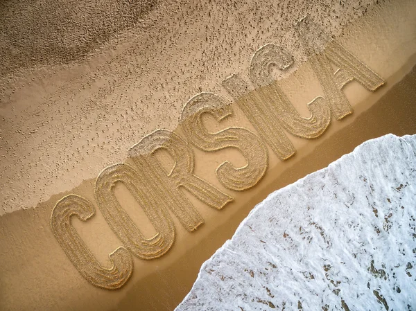 Corsica written on the beach — стоковое фото