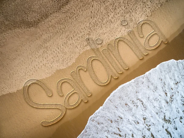 Cerdeña escrita en la playa — Foto de Stock