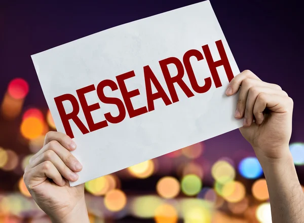 Research placard with night lights — Stock Photo, Image