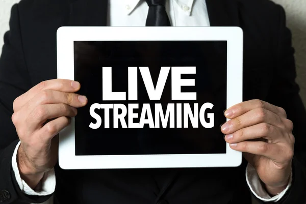 Businessman holding tablet with text — Stock Photo, Image