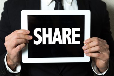 işadamı holding tablet ile metin