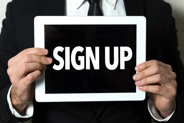 Businessman holding tablet with text — Stock Photo, Image