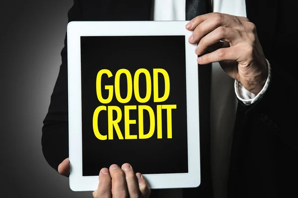 Businessman holding tablet with text — Stock Photo, Image