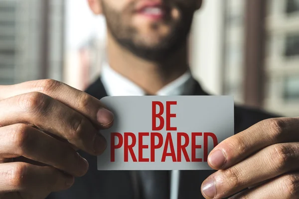 Businessman holding card with text — Stock Photo, Image