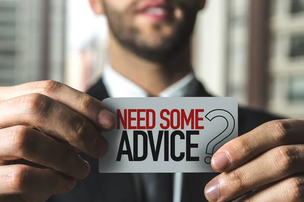 Businessman holding card with text — Stock Photo, Image