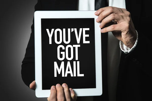 Businessman holding tablet with text — Stock Photo, Image