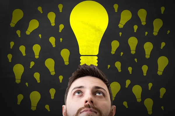 Man looking up on signs — Stock Photo, Image