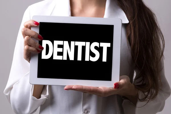 Doctor holding signboard — Stock Photo, Image