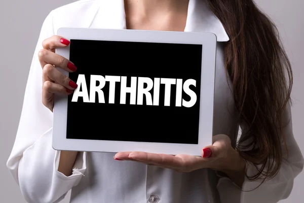 Key Signs of Arthritis Striking in Your 30s | Stock Photo