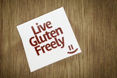 Live Gluten Freely on Paper Note on texture background clipart