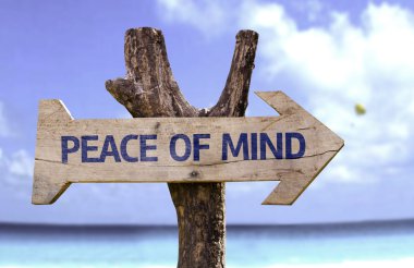 Peace of Mind wooden sign with a beach on background clipart